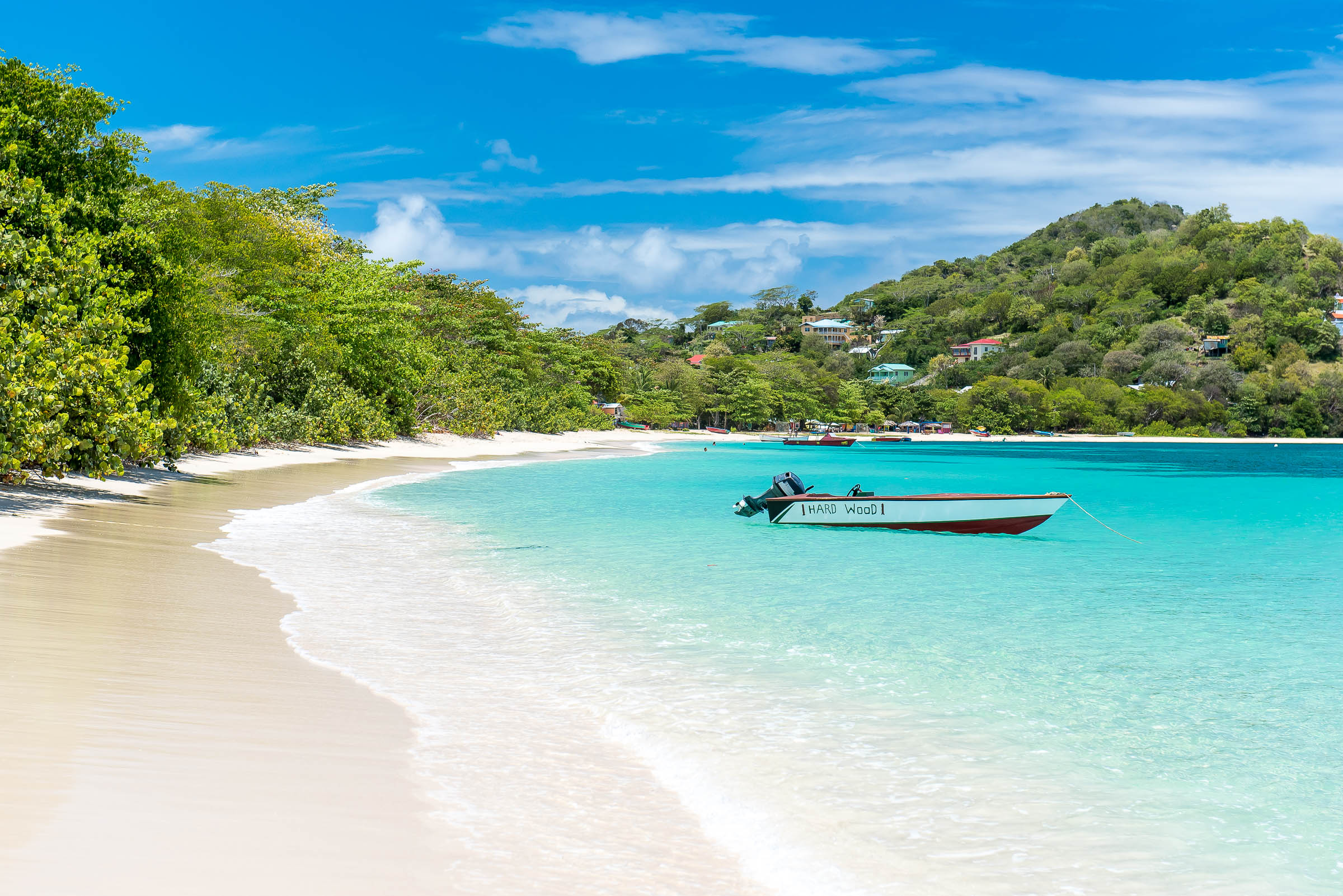 Carriacou paradise beach with small boat.