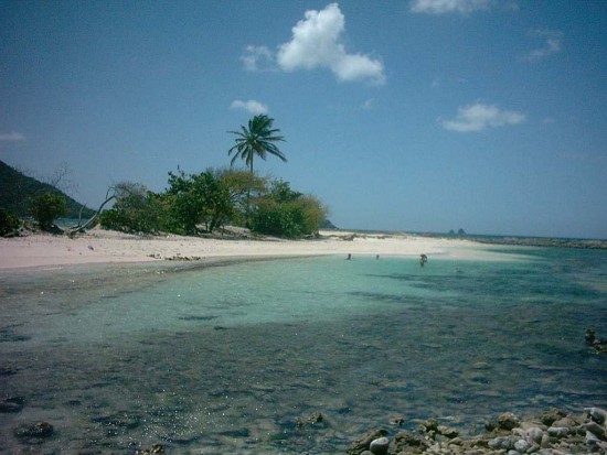 In front of Paradise beach is sandy island.