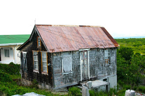 Windward traditional house with shingles.