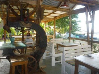 Old boatyard machinery as decoration of the Slipway Restaurant in Tyrell Bay on Carriacou.